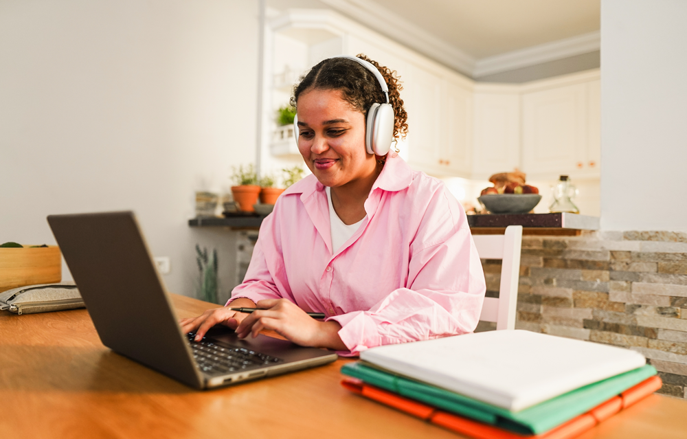 Girl Using Laptop To Study Language Beyond Limits
